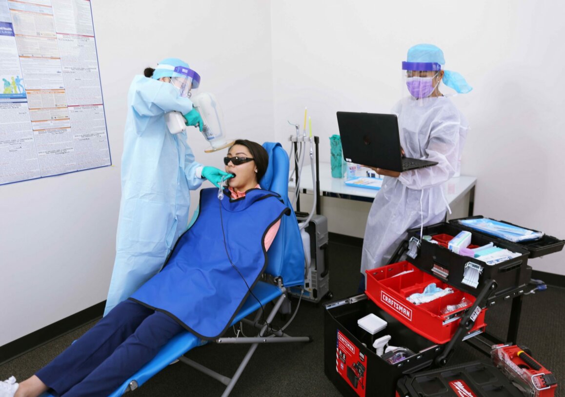 Dental professionals administering dental digital xrays at the office Dentistry at Home