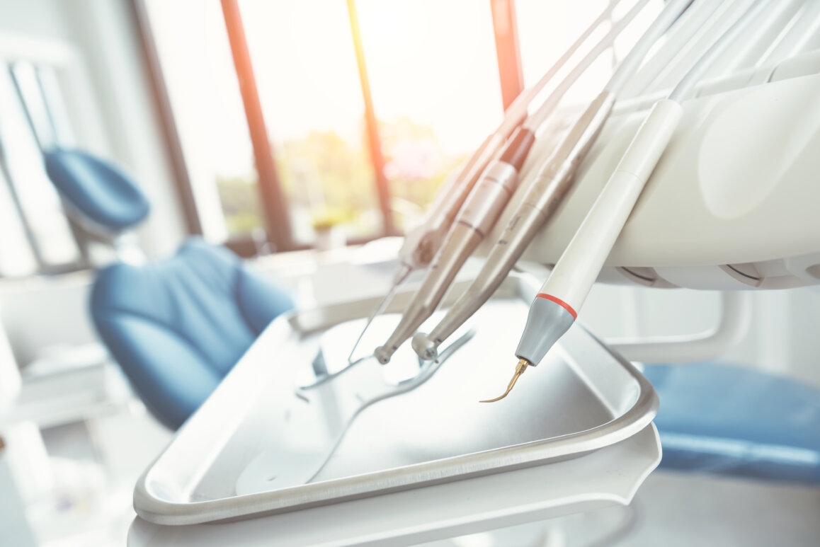 Dentist suite in a dental practice with instruments on a tray ready for the dentist.